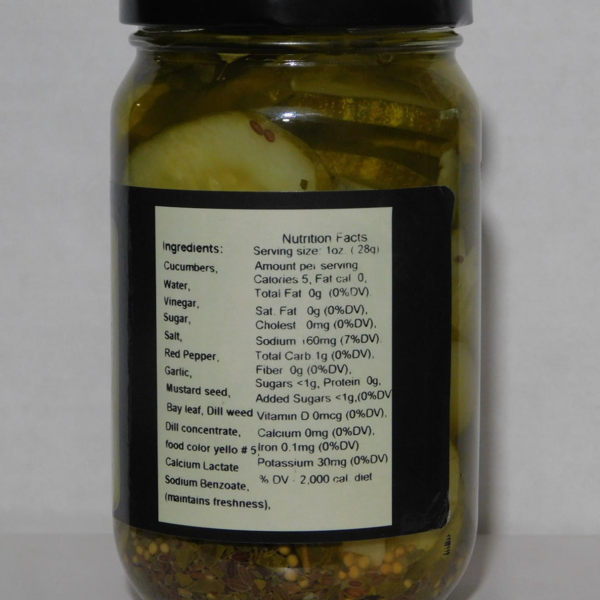 Jar of Penna Kosher Style Dill Pickle Chips with nutritional facts mentioned on it